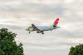 LONDON, ENGLAND - AUGUST 22, 2016: CS-TTK TAP Portugal Airbus A319 Landing in Heathrow Airport, London. Royalty Free Stock Photo