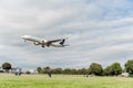 LONDON, ENGLAND - AUGUST 22, 2016: HZ-AK21 Saudi Arabian Airlines Boeing 777 Landing in Heathrow Airport, London. Royalty Free Stock Photo