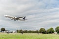 LONDON, ENGLAND - AUGUST 22, 2016: HZ-AK21 Saudi Arabian Airlines Boeing 777 Landing in Heathrow Airport, London. Royalty Free Stock Photo