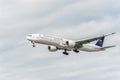 LONDON, ENGLAND - AUGUST 22, 2016: HZ-AK21 Saudi Arabian Airlines Boeing 777 Landing in Heathrow Airport, London. Royalty Free Stock Photo