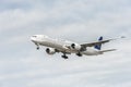 LONDON, ENGLAND - AUGUST 22, 2016: HZ-AK21 Saudi Arabian Airlines Boeing 777 Landing in Heathrow Airport, London. Royalty Free Stock Photo