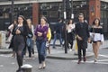 A large motley crowd walks up Bricklane on a Sunday afternoon. The flea market on Bricklane works on Sundays. Royalty Free Stock Photo