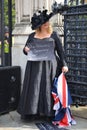 Woman standing with a protesting poster in London Royalty Free Stock Photo