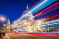 London, England - Beautiful Saint Paul`s Cathedral with iconic red double decker buses on the move Royalty Free Stock Photo