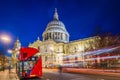 London, England - Beautiful Saint Paul`s Cathedral with traditional red double decker bus at night Royalty Free Stock Photo