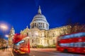 London, England - Beautiful Saint Pauls Cathedral with iconic red double decker buses