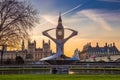 London, England - The Big Ben, the famous icon of London with the Houses of Parliament and red double decker buses