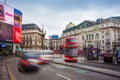 London, England - 03.15.2018: Busy traffic at Piccadilly Circus with iconic red Double-Decker bus and black taxi Royalty Free Stock Photo