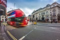 London, England - 03.15.2018: Busy traffic at Piccadilly Circus with iconic red Double-Decker buses on the move Royalty Free Stock Photo