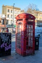 London, England Ã¢â¬â December 2022. Classic, retro red phone booth. London\'s vintage red phone boxes in Punk version