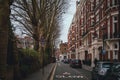 LONDON, ENGLAND, DECEMBER 29, 2018: Facades in London on quietly street with signs of slow speed for school crossing Royalty Free Stock Photo