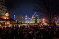 LONDON, ENGLAND, DECEMBER 28, 2018: People enjoying a pleasant time in a Christmas market, surrounded by food and drink stands,