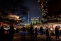 LONDON, ENGLAND, DECEMBER 28, 2018: People enjoying a pleasant time in a Christmas market, surrounded by food and drink stands,