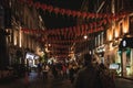 LONDON, ENGLAND, DECEMBER 10th, 2018: People walking in China Town, decorated by Chinese lanterns during christmas and new year in Royalty Free Stock Photo