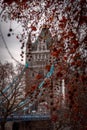 LONDON, ENGLAND, DECEMBER 10th, 2018: Tower Bridge in London, the UK. Seen from behind White Tower trees during winter Royalty Free Stock Photo