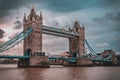 LONDON, ENGLAND, DECEMBER 10th, 2018: Tower Bridge in London, the UK. Sunrise with beautiful clouds. English symbols