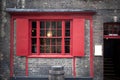 Window with red shutters, decorated with a drawing with a horse in a traditional Christmas style about the south bank in London