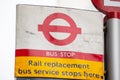 LONDON, ENGLAND- 17 February 2021: `Rail replacement bus service stops here` sign on a TFL bus stop