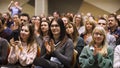 London - England, 02.08.2020: Feminist women attend seminar sitting in a conference room. Art. Women listen to the