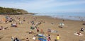 London, England, Folkestone, kent: June 1st 2019:Tourists on Sunny sands beach enjoying the beautiful sunshine and blue sky on the