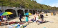 London, England, Folkestone, kent: June 1st 2019:Tourists on Sunny sands beach enjoying the beautiful sunshine and blue sky on the