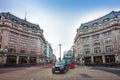 London, England - Iconic black taxi and red double decker bus at the famous Oxford Circus with Oxford Street and Regent Street Royalty Free Stock Photo