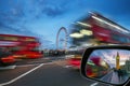 London, England - iconic red double-decker buses on the move on Westminster Bridge with Big Ben and Houses of Parliament Royalty Free Stock Photo