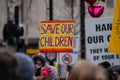 LONDON, ENGLAND- 22 January 2022:A SAVE OUR CHILDREN placard at the NHS100K protest against vaccine mandates for NHS staff