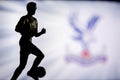 LONDON, ENGLAND, JULY. 1. 2019: Crystal Palace Football club logo, Premier League, England. Soccer player silhouette Royalty Free Stock Photo