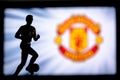 LONDON, ENGLAND, JULY. 1. 2019: Manchester United Football club logo, Premier League, England. Soccer player silhouette Royalty Free Stock Photo