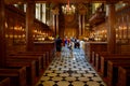 Tourists admiring the stunning interior in the Chapel Royal at Hampton Court Palace