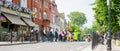 Women in hijab among group crossing street in urban street scene showing modern city diversity Royalty Free Stock Photo