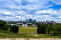 Skyline view of the skyscrapers of Canary Wharf and national maritime museum, shot from Greenwich park. London, UK Royalty Free Stock Photo