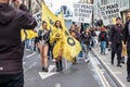 LONDON, ENGLAND- 13 March 2022: Revellers at a Dance For Peace Parade to fundraise for Red Cross and Disasters Emergency Committee