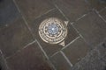 Metal plaque in pavement, marking the Princess Diana Memorial Walk in London. England