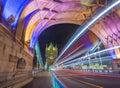 London, England - Night shot of the world famous colorful Tower Bridge in London with double decker bus light trails Royalty Free Stock Photo