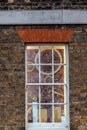 Imagine clocks through a window at the Royal Observatory in Greenwich
