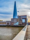 Shard Tower and the banks of Thames river below London Bridge Royalty Free Stock Photo