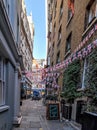 London, England, November 25, 2022: Picturesque Lovat Lane, and the square is a walk, with various buildings and premises