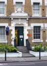 London, England - November 03, 2017: Traffic warden leaving the centre building in kings cross road london a historic former polic