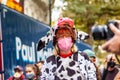 LONDON/ENGLAND- 10 October 2020: Extinction Rebellion wearing a cow costume, protesting to end the destruction of the Amazon Royalty Free Stock Photo