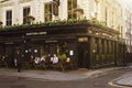 Old fashioned style London corner pub. Warm sunny day in the city Royalty Free Stock Photo