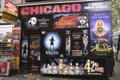 Posters and flyers advertising musical shows like chicago, aladdin and Matilda on a wall in