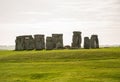 Stonehenge is a prehistoric monument on Salisbury Plain in Wiltshire, England, two miles west of Amesbury.