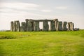 Stonehenge is a prehistoric monument on Salisbury Plain in Wiltshire, England, two miles west of Amesbury.