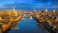 London, England - Panoramic aerial skyline view of London including iconic Tower Bridge with red double-decker bus Royalty Free Stock Photo