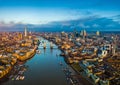 London, England - Panoramic aerial skyline view of London including Tower Bridge with red double-decker bus