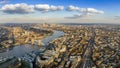 London, England - Panoramic aerial view of London with the famous Tower and Tower Bridge and skyscrapesr of Canary Wharf Royalty Free Stock Photo