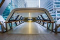 London, England - Pedestrian cross rail footbridge at the financial district of Canary Wharf with skyscrapers Royalty Free Stock Photo