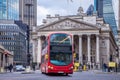 London, England - The Royal Exchange building with moving double decker bus Royalty Free Stock Photo